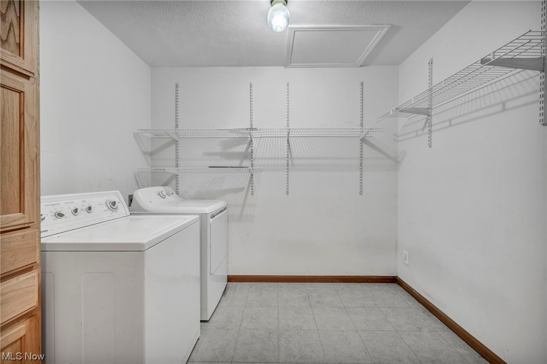 35808 Lorain Road North Ridgeville, OH 44039 - Photo 18 of 35 Clothes washing area featuring light tile flooring and washing machine and dryer
