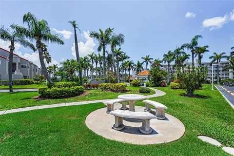 a view of a house with a swimming pool and a garden