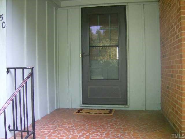 250 Winhaven Street Roxboro, NC 27573 - Photo 2 of 12 Front porch has inlaid broken tile