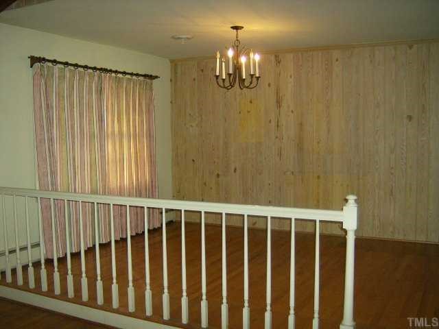 250 Winhaven Street Roxboro, NC 27573 - Photo 5 of 12 Dining is seperated from living with railings