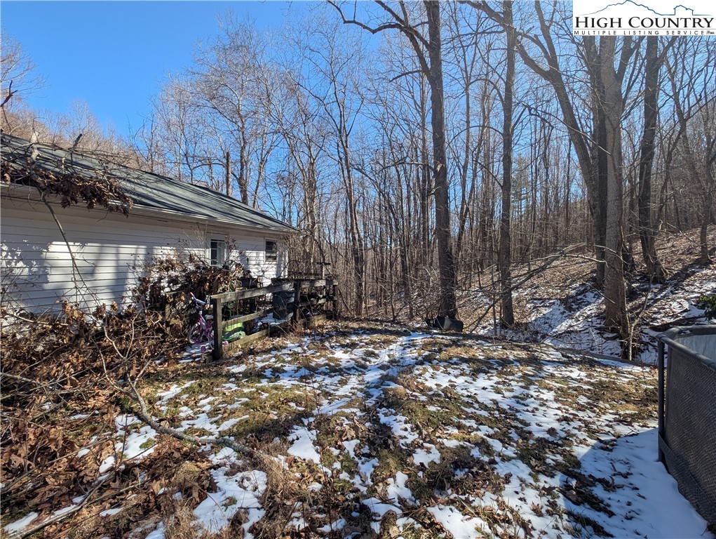 435 Edwards Road West Jefferson, NC 28694 - Photo 11 of 23 a view of a barn with big tree and a yard