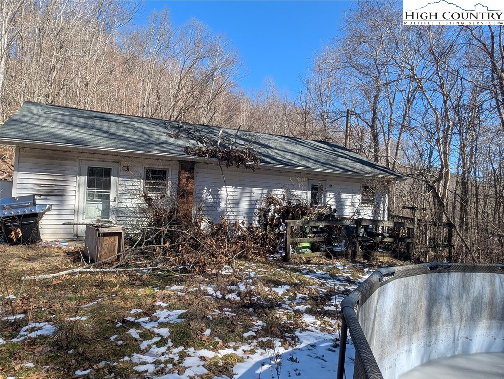 435 Edwards Road West Jefferson, NC 28694 - Photo 14 of 23 a view of a house with backyard porch and sitting area