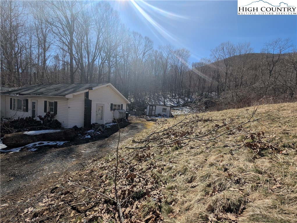 435 Edwards Road West Jefferson, NC 28694 - Photo 20 of 23 a house view with a backyard