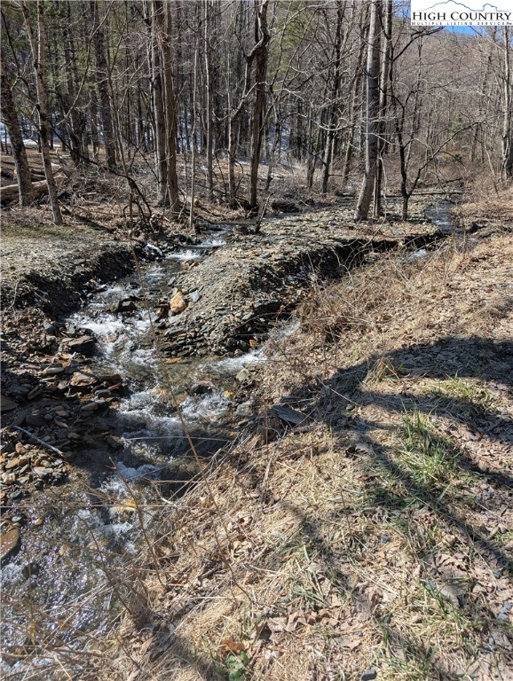 435 Edwards Road West Jefferson, NC 28694 - Photo 3 of 23 a view of outdoor space with wooden fence