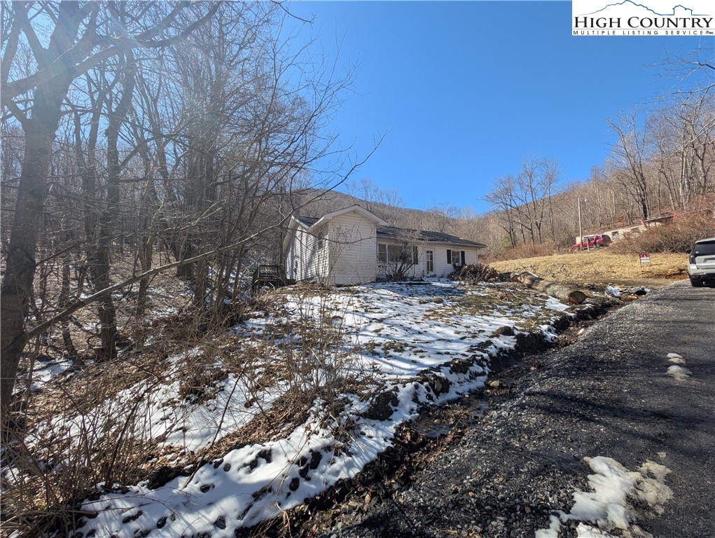 435 Edwards Road West Jefferson, NC 28694 - Photo 7 of 23 a view of a dry yard with wooden fence