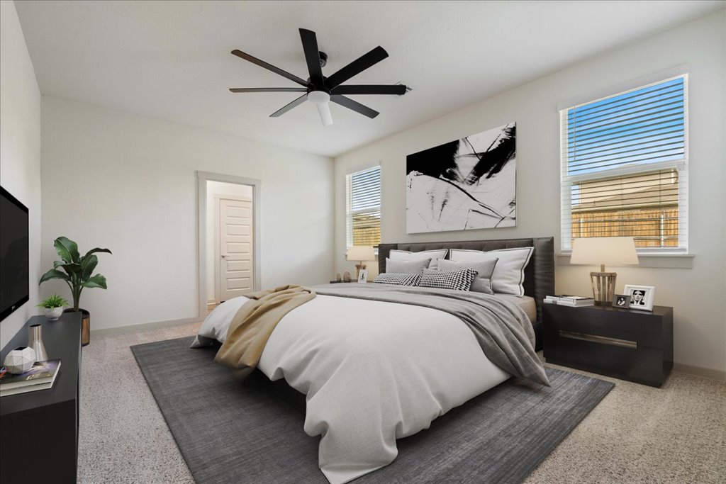 7410 Sagira Path Austin, TX 78724 - Photo 13 of 37 a bedroom with a bed and ceiling fan