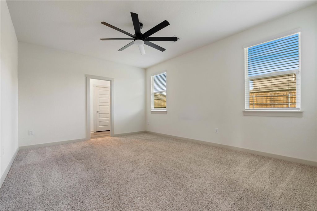 7410 Sagira Path Austin, TX 78724 - Photo 14 of 37 an empty room with a window and a fan