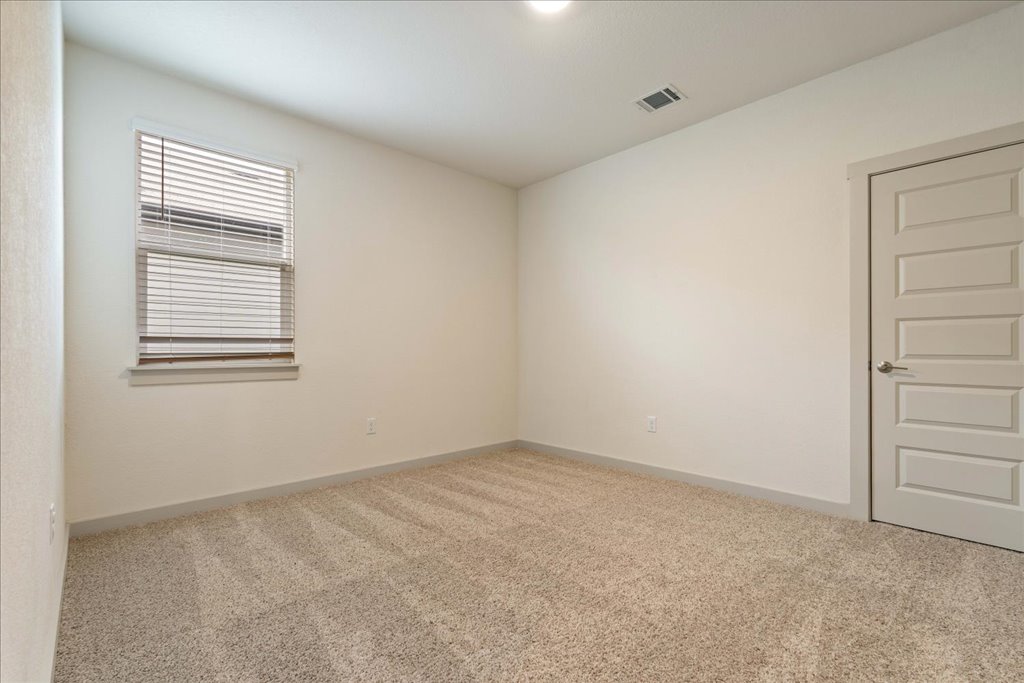 7410 Sagira Path Austin, TX 78724 - Photo 18 of 37 a view of an empty room with a window