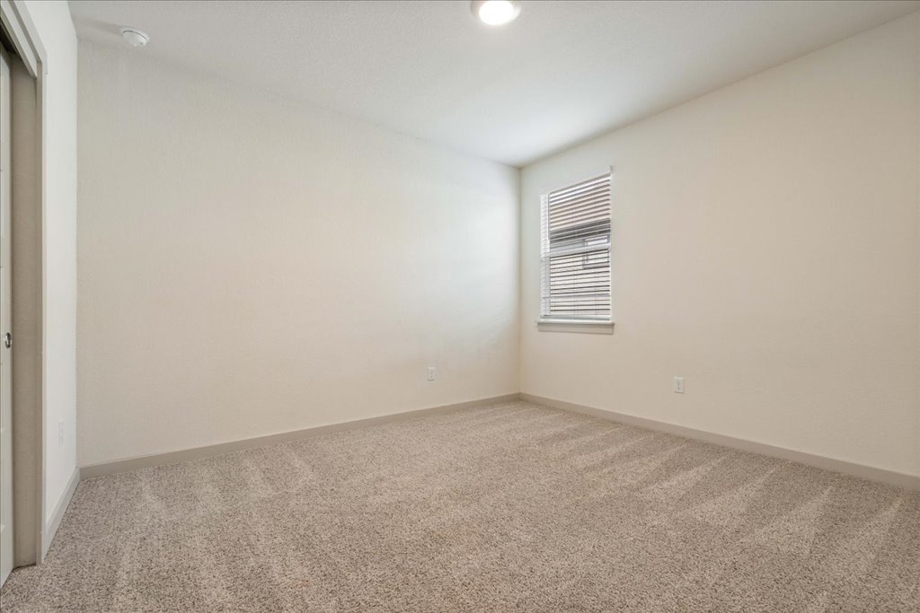 7410 Sagira Path Austin, TX 78724 - Photo 20 of 37 a view of an empty room with a window