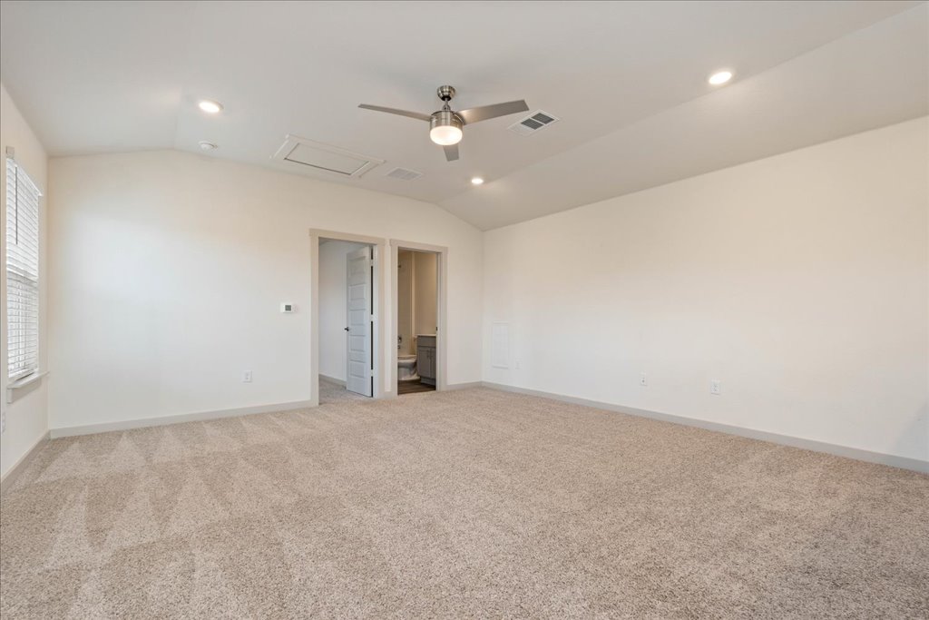7410 Sagira Path Austin, TX 78724 - Photo 22 of 37 an empty room with a ceiling fan and window