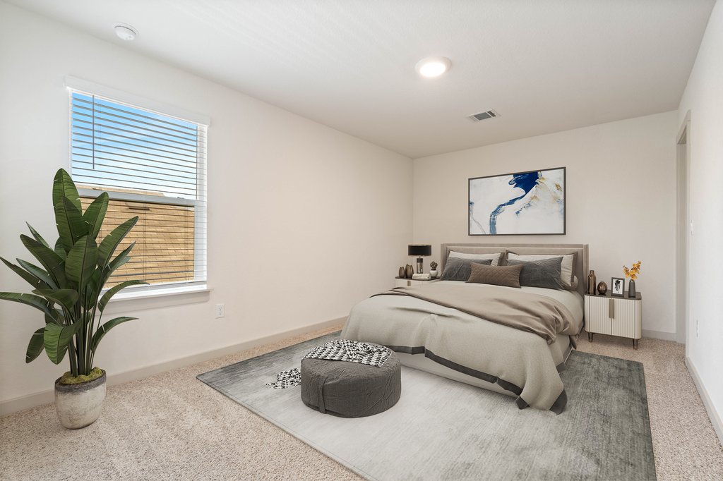 7410 Sagira Path Austin, TX 78724 - Photo 25 of 37 a bedroom with a bed and a potted plant