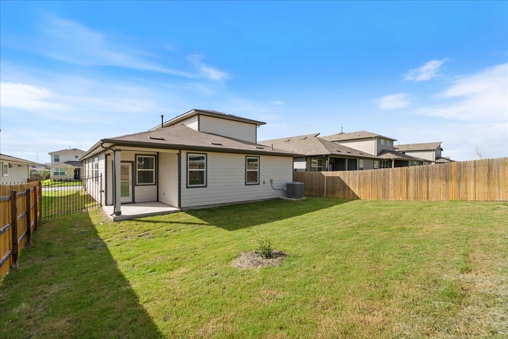 7410 Sagira Path Austin, TX 78724 - Photo 30 of 37 a view of a house with a yard