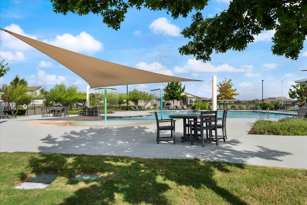 7410 Sagira Path Austin, TX 78724 - Photo 35 of 37 a view of a lake with a table and chairs