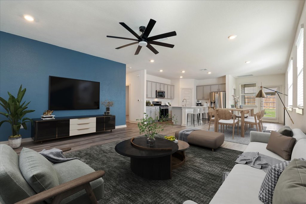 7410 Sagira Path Austin, TX 78724 - Photo 6 of 37 a living room with furniture and a flat screen tv