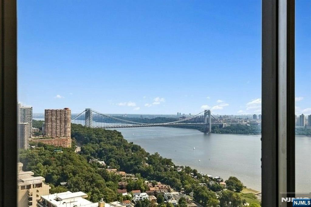 6 Horizon Road, Unit 2209 Fort Lee, NJ 07024 - Photo 4 of 50 a view of a lake with a city skyline in the background