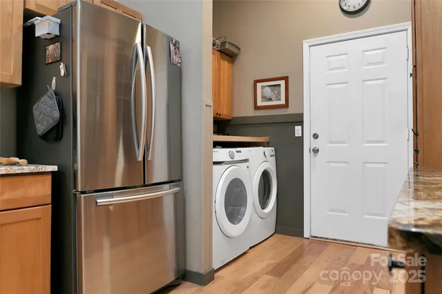 a bedroom with furniture a flat screen tv and a fireplace