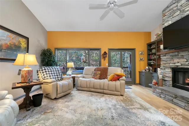 a bedroom with furniture and a flat screen tv