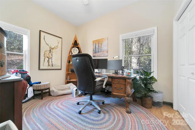 a very nice looking living room with furniture and a large window