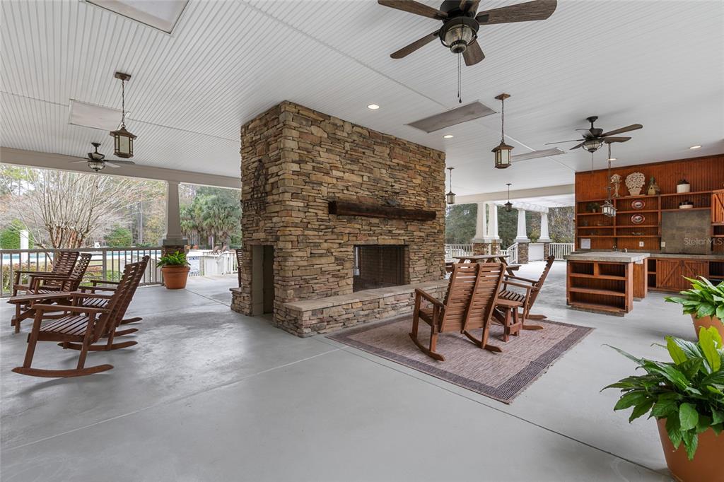 2004 Southwest 188th Street Newberry, FL 32669 - Photo 8 of 14 a living room with furniture a fireplace and a ceiling fan