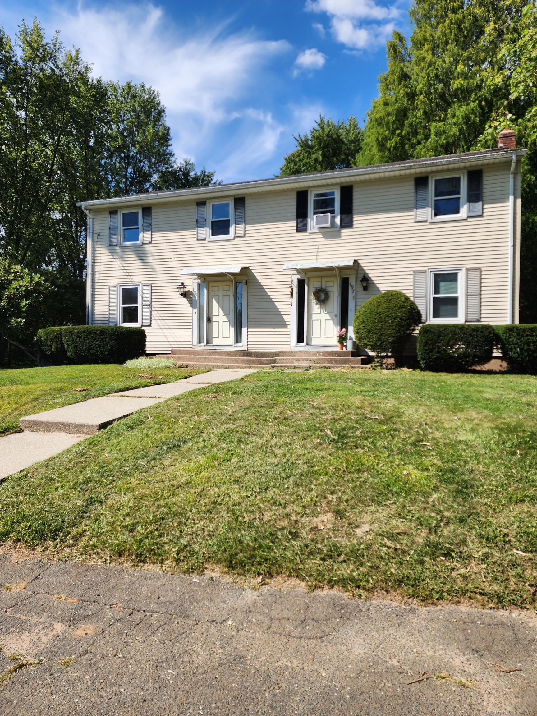 195 Wall Street Hebron, CT 06248 - Photo 1 of 12 a front view of a house with a yard and garage