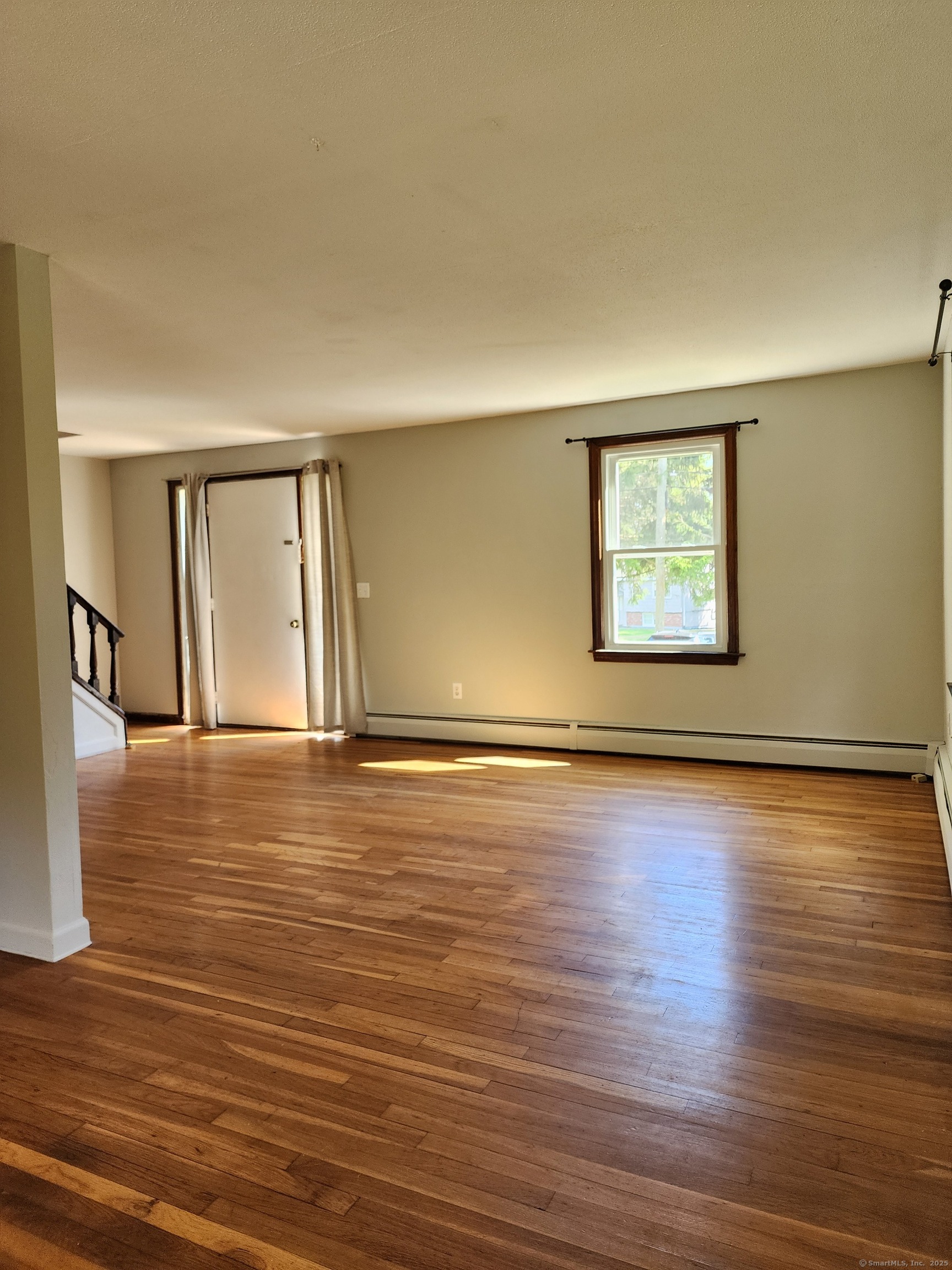 195 Wall Street Hebron, CT 06248 - Photo 2 of 12 a view of a room with wooden floor and window