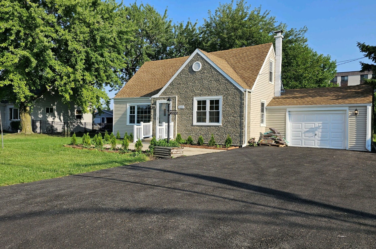 7233 West 85th Street Bridgeview, IL 60455 - Photo 1 of 15 a front view of house with yard and green space