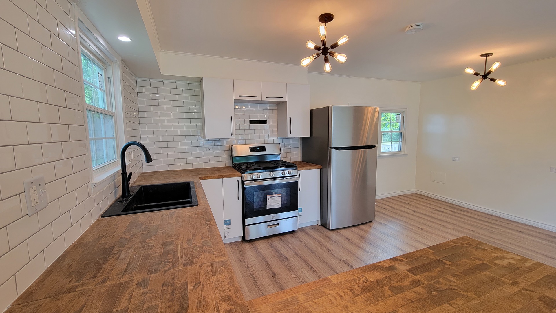 7233 West 85th Street Bridgeview, IL 60455 - Photo 6 of 15 a kitchen with a sink and a stove top oven