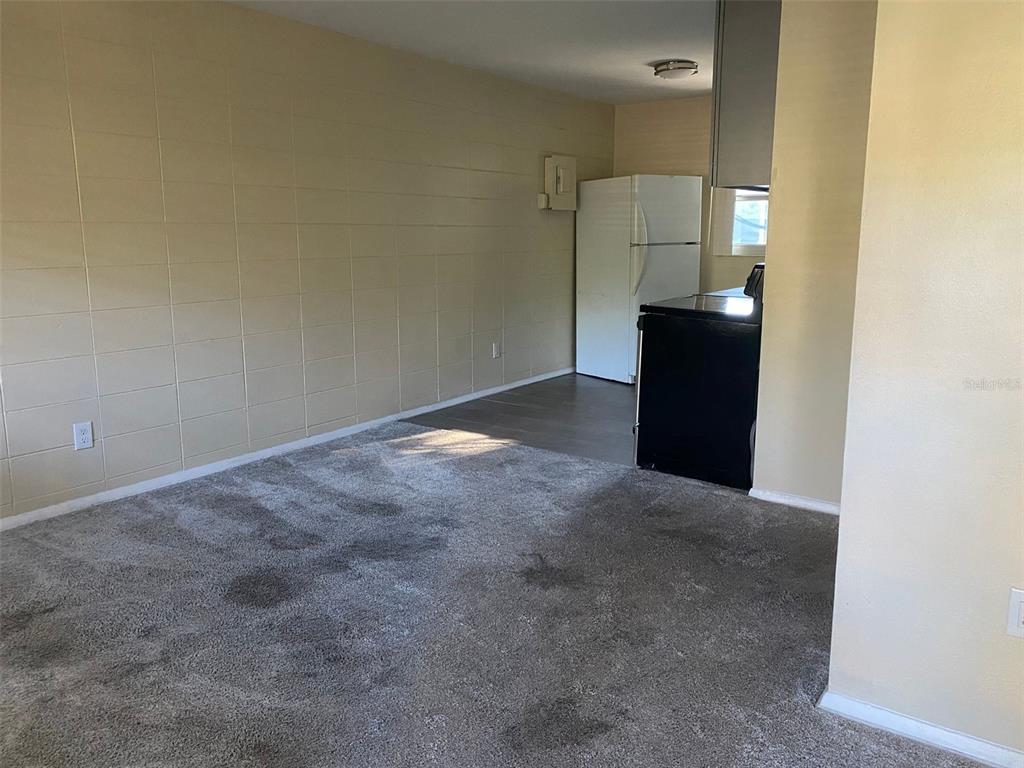 639 Ramona Lane, Unit 8 Orlando, FL 32805 - Photo 4 of 11 a view of an empty room and a bathroom