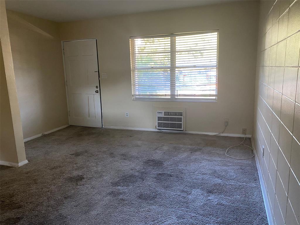 639 Ramona Lane, Unit 8 Orlando, FL 32805 - Photo 5 of 11 an empty room with windows
