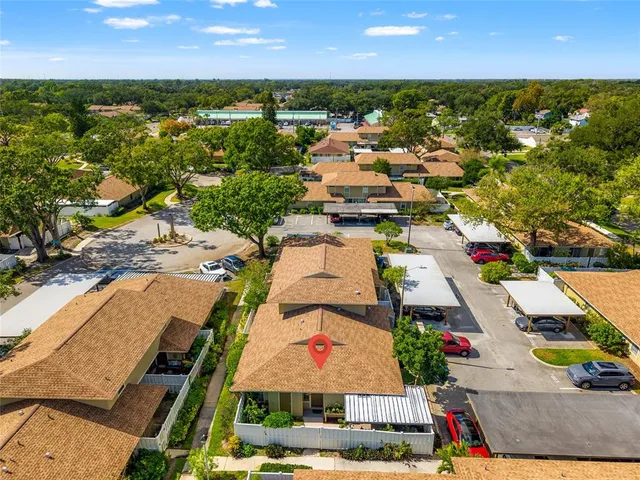 an aerial view of residential houses with outdoor space
