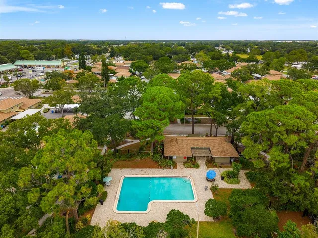 an aerial view of a house with a swimming pool