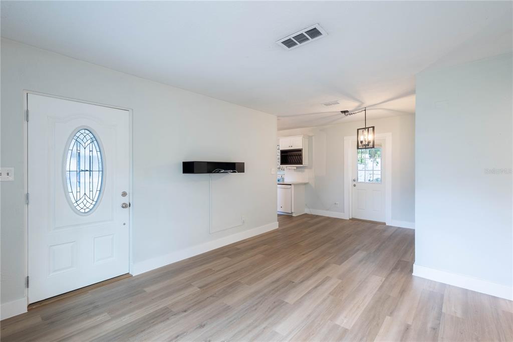314 4th Avenue Southwest Ruskin, FL 33570 - Photo 6 of 30 a view of empty room with wooden floor and window