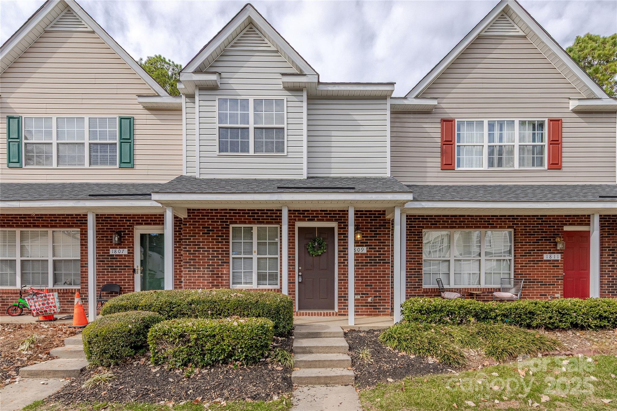 1809 Birch Heights Court Charlotte, NC 28213 - Photo 1 of 23 a view of a brick house with large windows