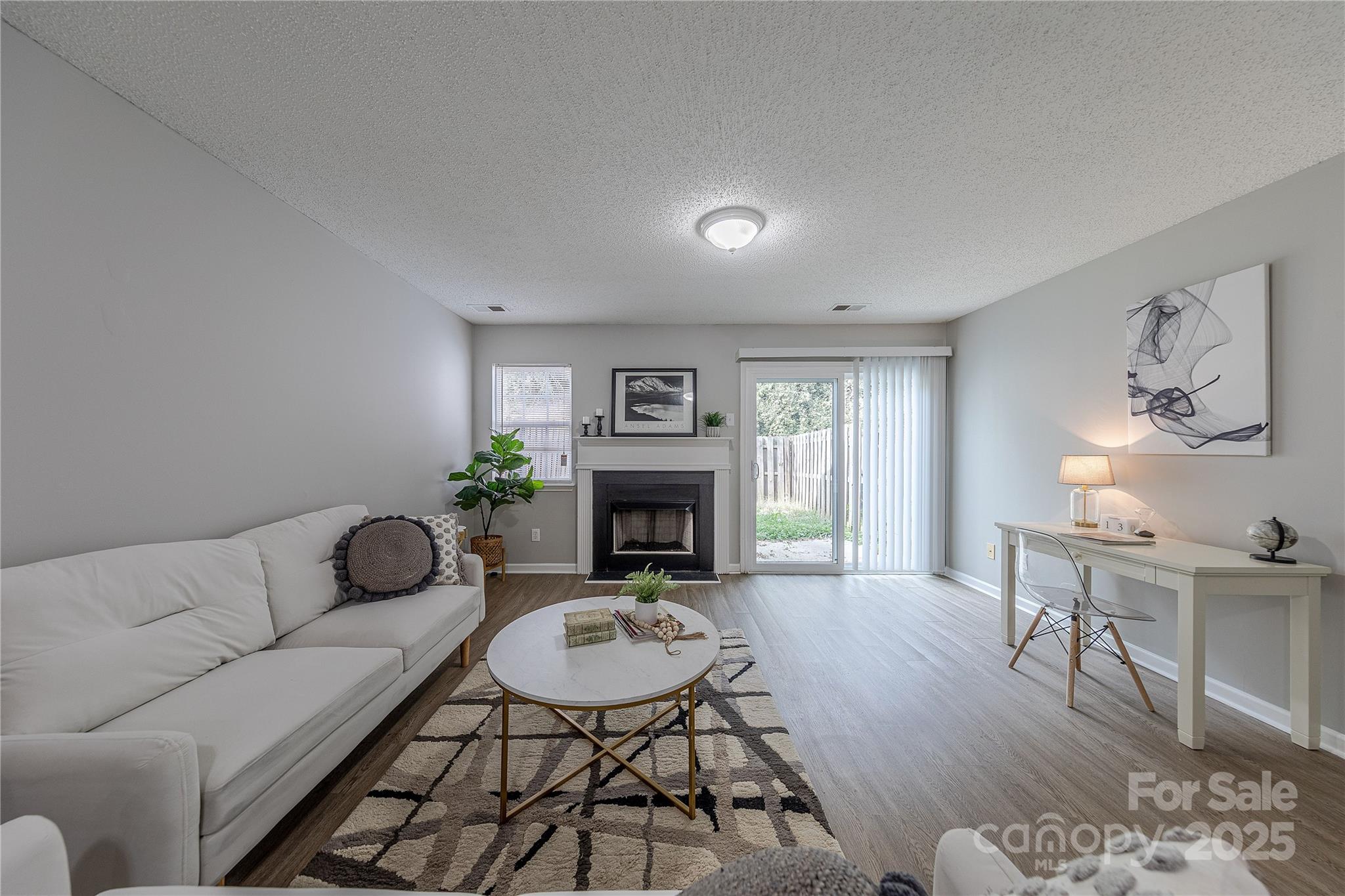 1809 Birch Heights Court Charlotte, NC 28213 - Photo 12 of 23 a living room with furniture a fireplace and a table
