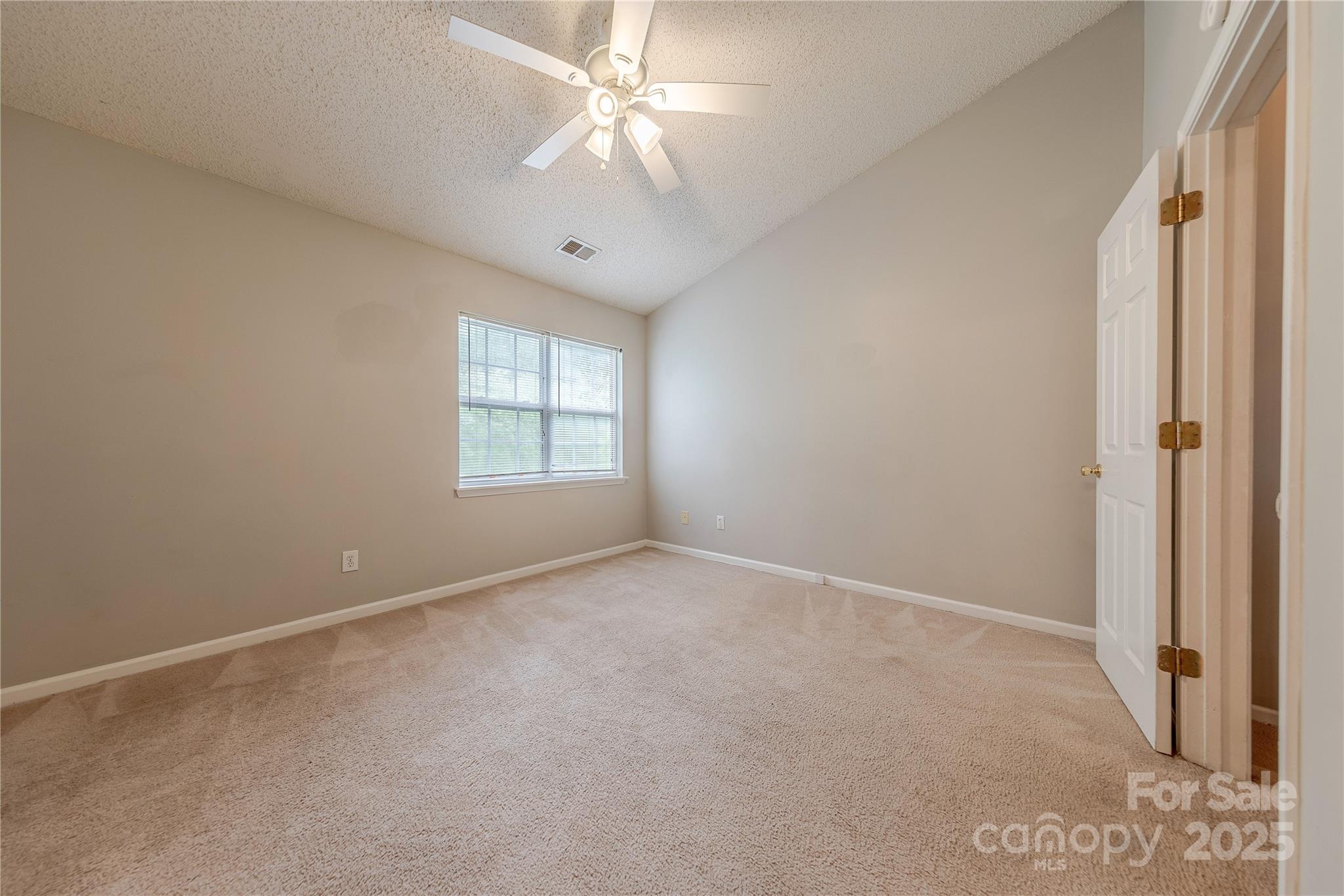1809 Birch Heights Court Charlotte, NC 28213 - Photo 15 of 23 an empty room with windows and fan