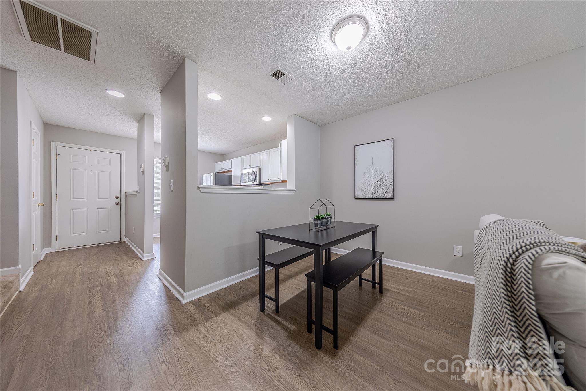 1809 Birch Heights Court Charlotte, NC 28213 - Photo 7 of 23 a view of a hallway with wooden floor and furniture
