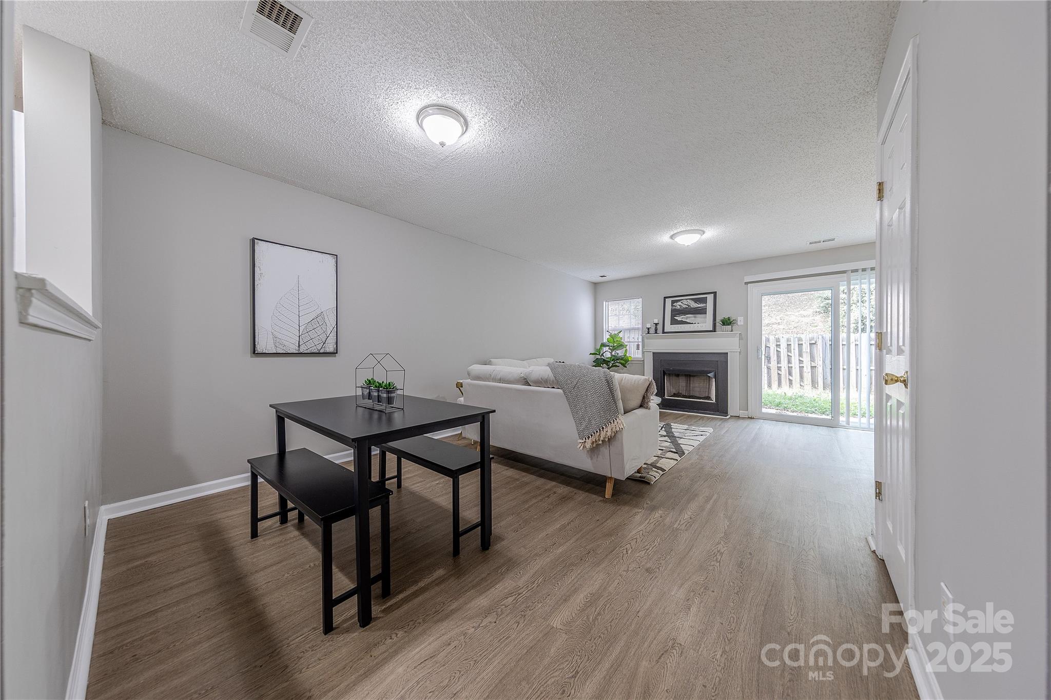 1809 Birch Heights Court Charlotte, NC 28213 - Photo 8 of 23 a living room with furniture a table and wooden floor
