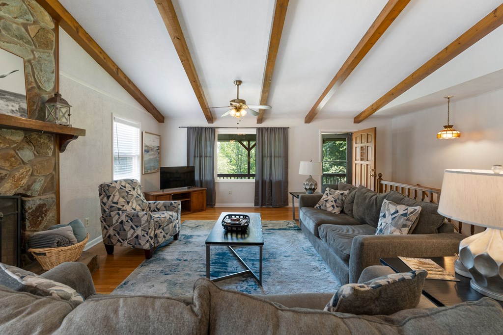 568 Prince Drive Morganton, GA 30560 - Photo 13 of 30 a living room with furniture and a fireplace