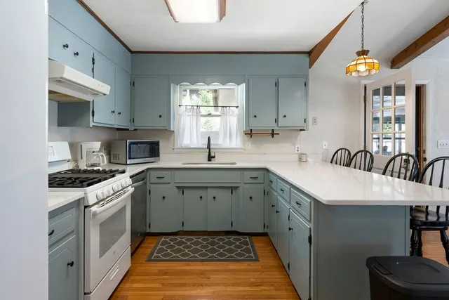 a kitchen with a sink and a microwave