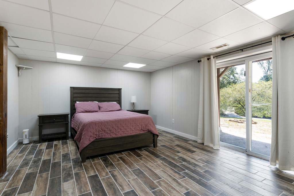 568 Prince Drive Morganton, GA 30560 - Photo 25 of 30 a bedroom with a bed and wooden floor