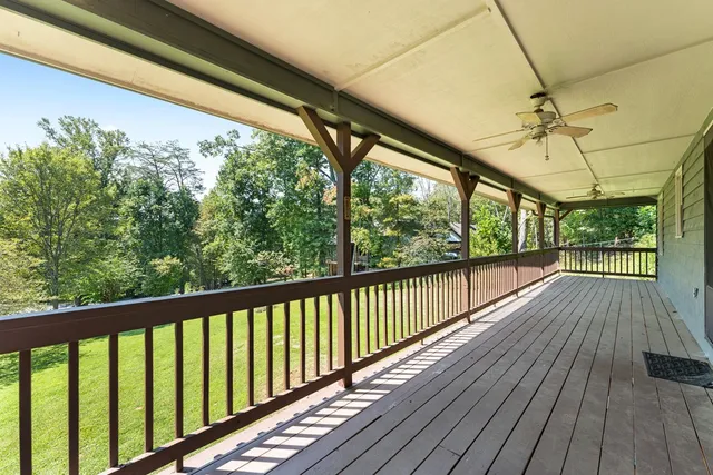 a view of a balcony with wooden floor