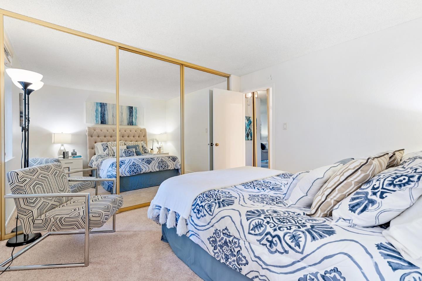 505 Cypress Point Drive, Unit 160 Mountain View, CA 94043 - Photo 12 of 20 a bedroom with a bed and wooden floor