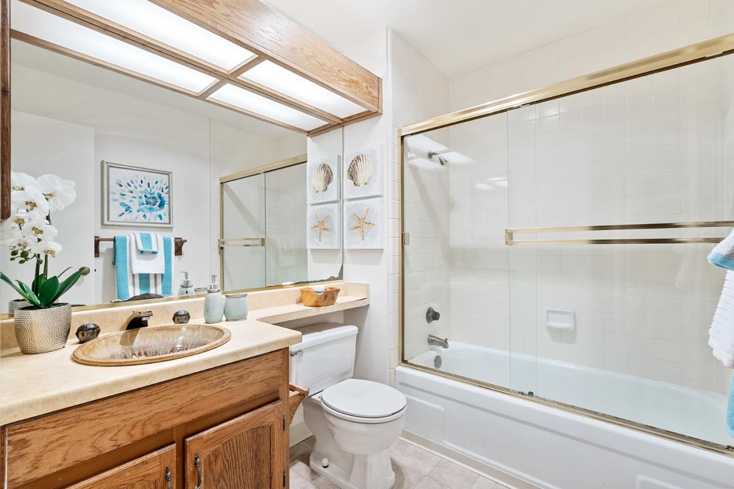 505 Cypress Point Drive, Unit 160 Mountain View, CA 94043 - Photo 13 of 20 a bathroom with a granite countertop sink toilet and shower