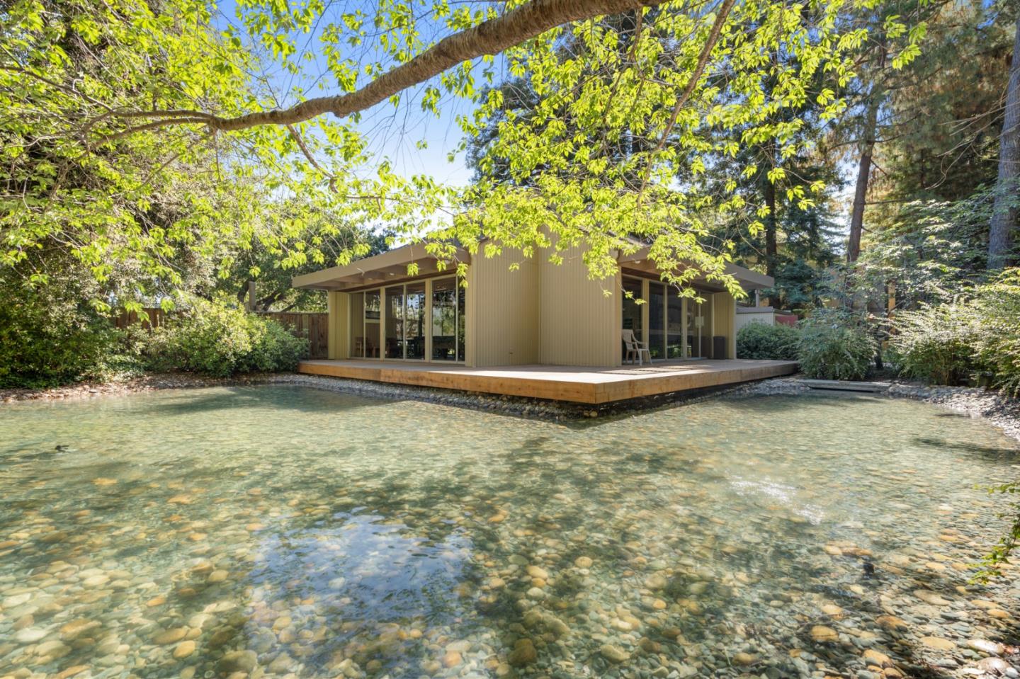 505 Cypress Point Drive, Unit 160 Mountain View, CA 94043 - Photo 20 of 20 a backyard of a house with large trees and entertaining space