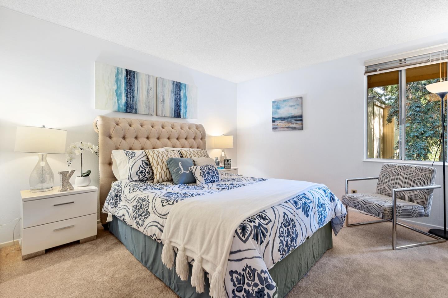505 Cypress Point Drive, Unit 160 Mountain View, CA 94043 - Photo 10 of 20 a bedroom with a bed and a window