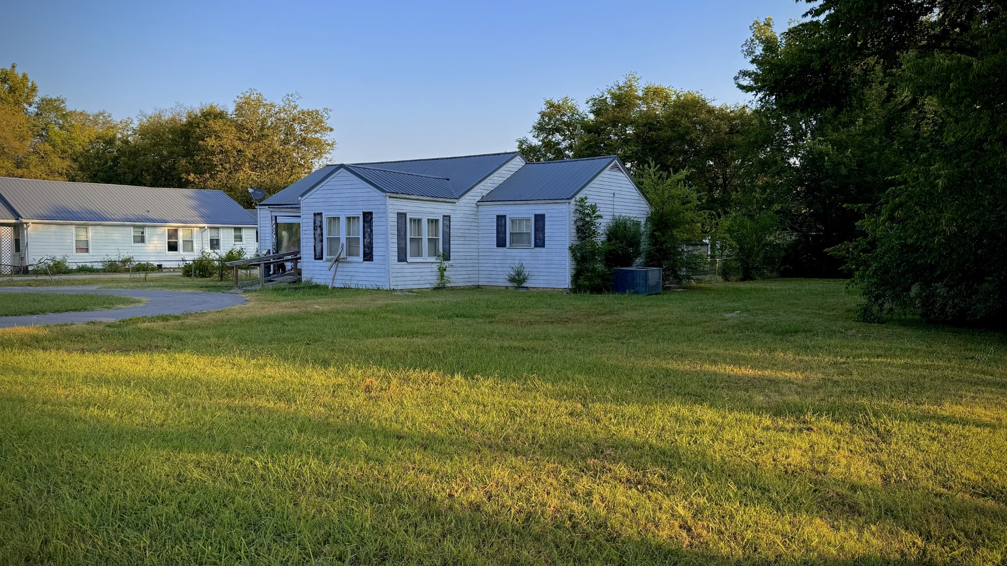 905 Hickory Ridge Road Lebanon, TN 37087 - Photo 4 of 9 a front view of a house with a garden and trees