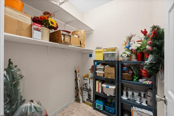 a bedroom with a bed and a flat tv screen on the dresser