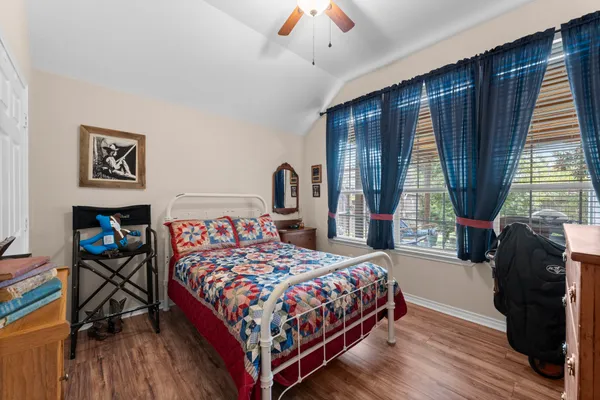 a bathroom with a double vanity sink mirror and toilet