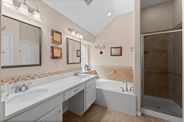 a bathroom with a bathtub and a shower