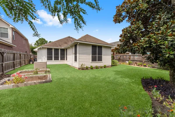a view of a back yard of the house